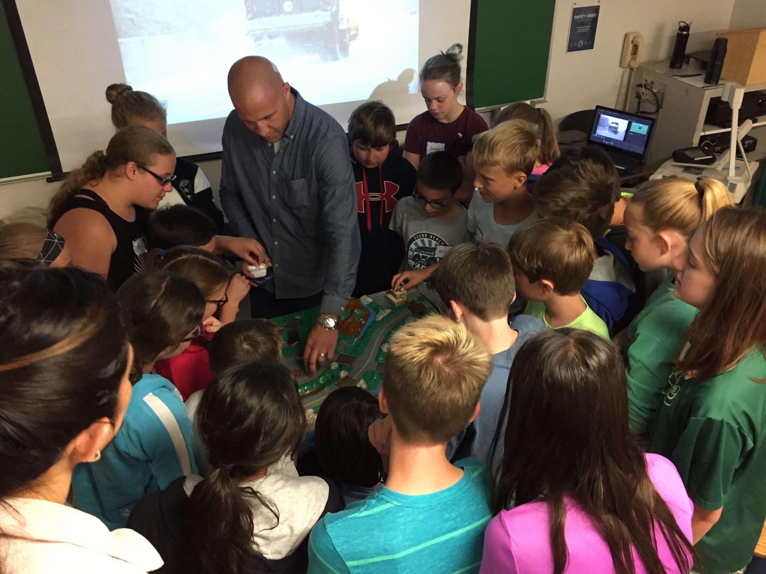 MHFD employee teaching young students about flood safety